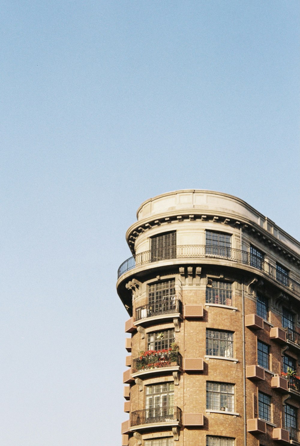 a tall building with a clock on the top of it