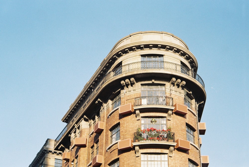 a tall building with lots of windows and balconies