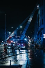 a fire truck and a firetruck on a city street at night