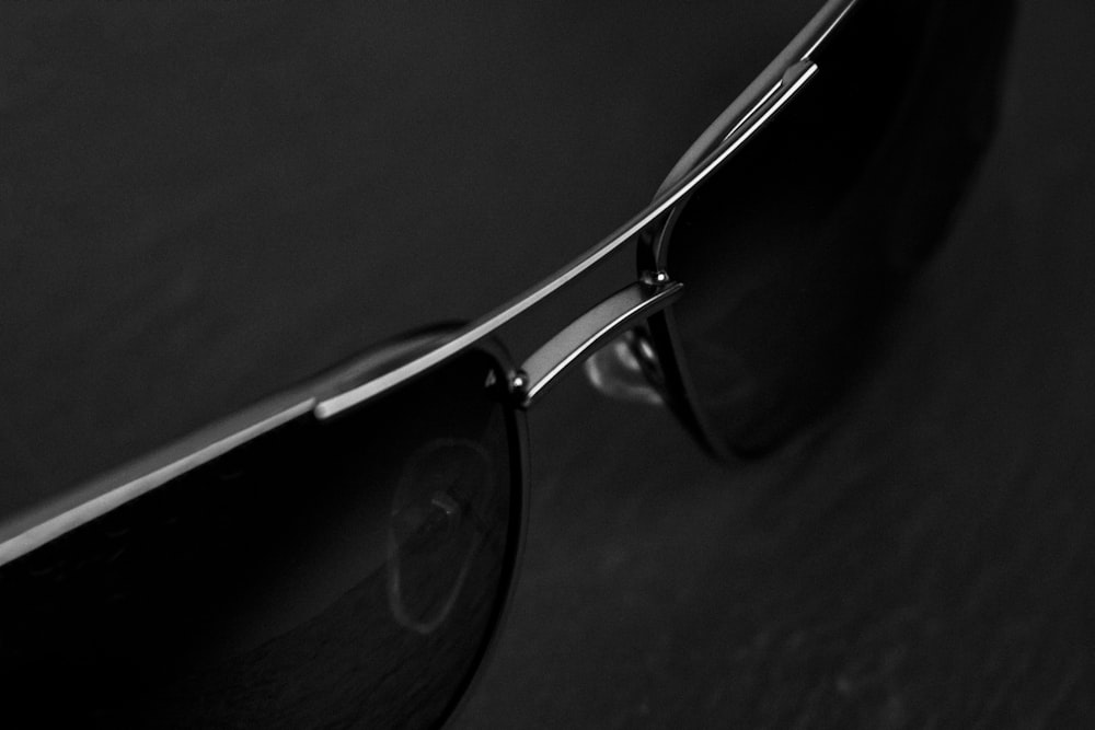 a pair of sunglasses sitting on top of a table