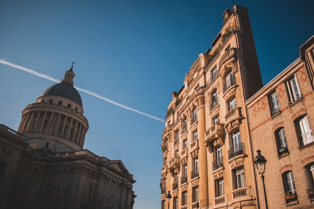 a tall building next to a very tall building