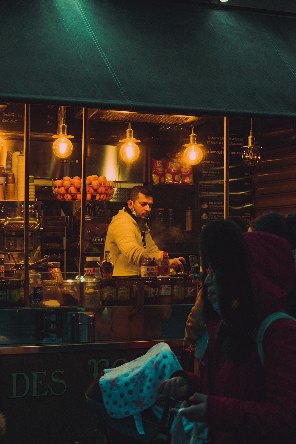 a couple of people that are standing in front of a store