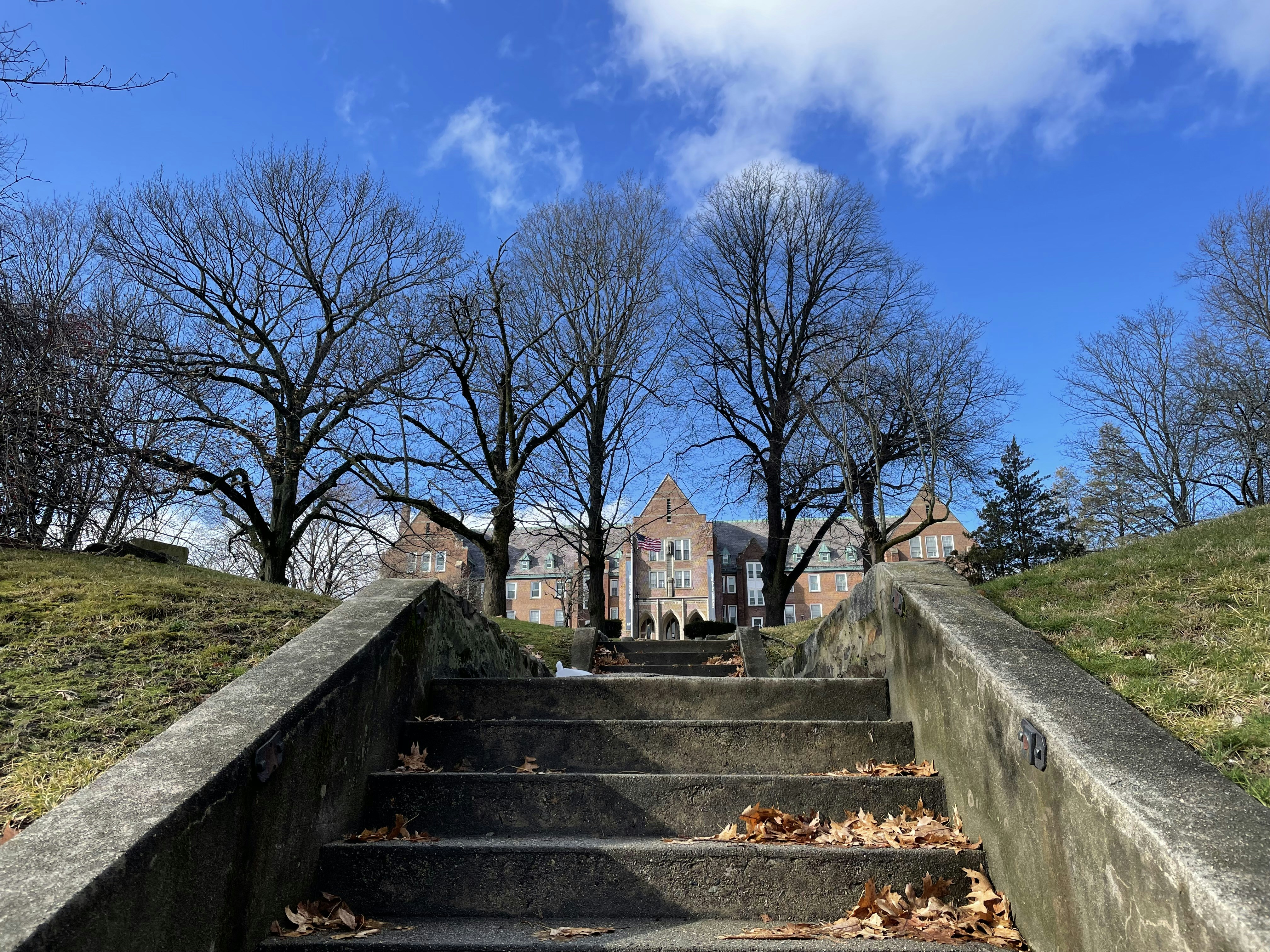 a set of stairs leading up to a building, Step in.
