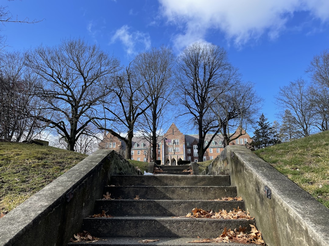 a set of stairs leading up to a building, Step in.