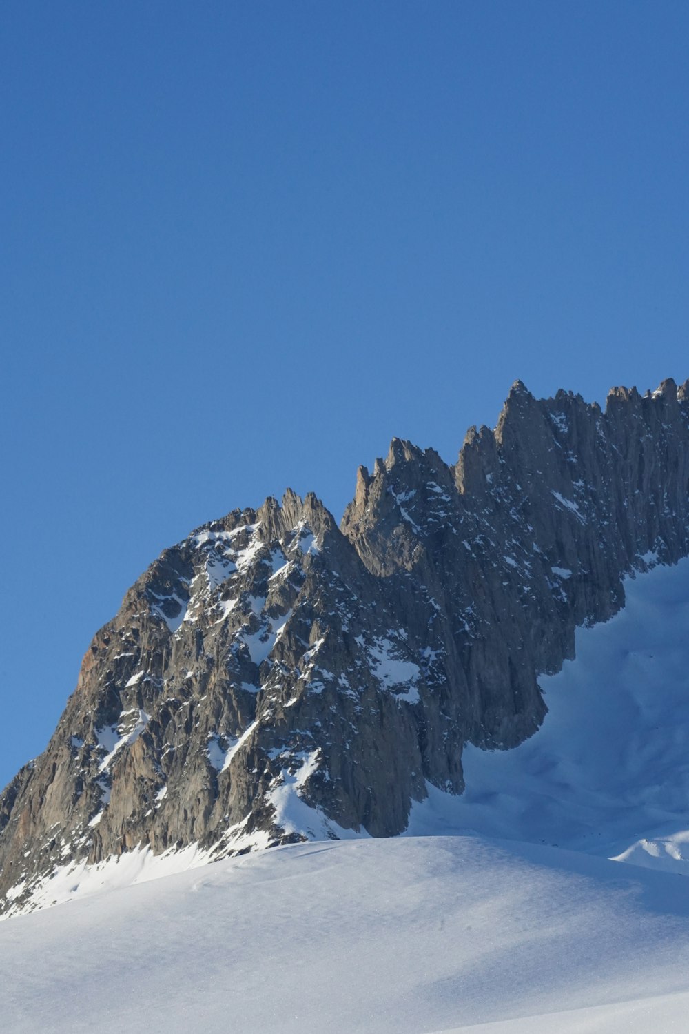 a person skiing down a snow covered mountain