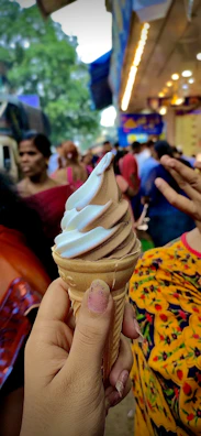 Family enjoying colorful soft serve ice cream cones on a sunny day at a charming outdoor ice cream stand