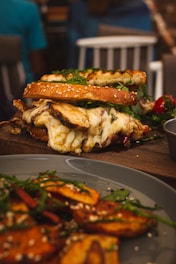 a close up of a plate of food with a sandwich