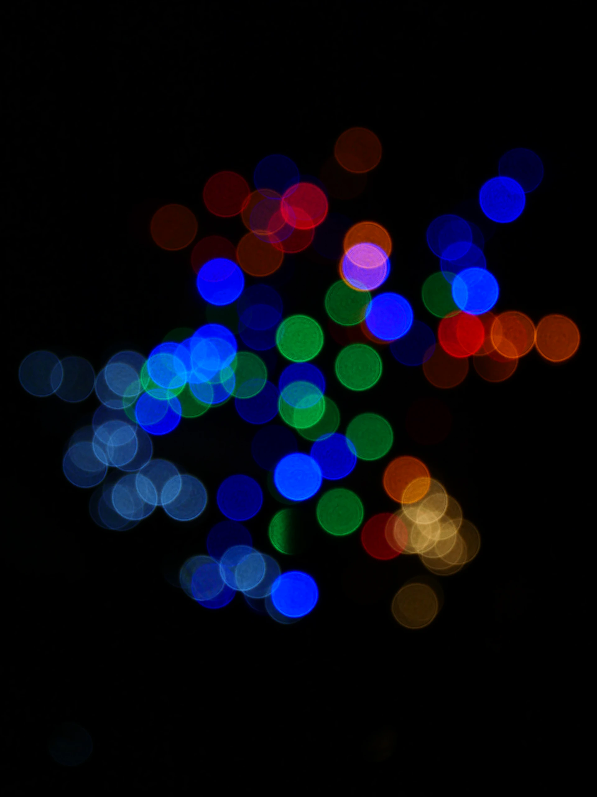 a blurry photo of some lights in the dark