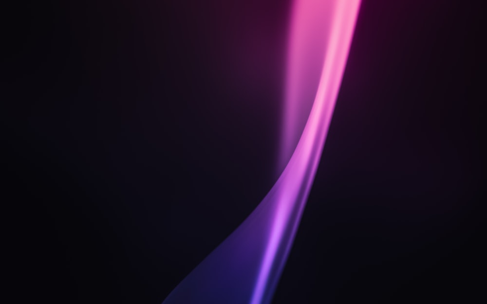 a black background with pink and purple lines