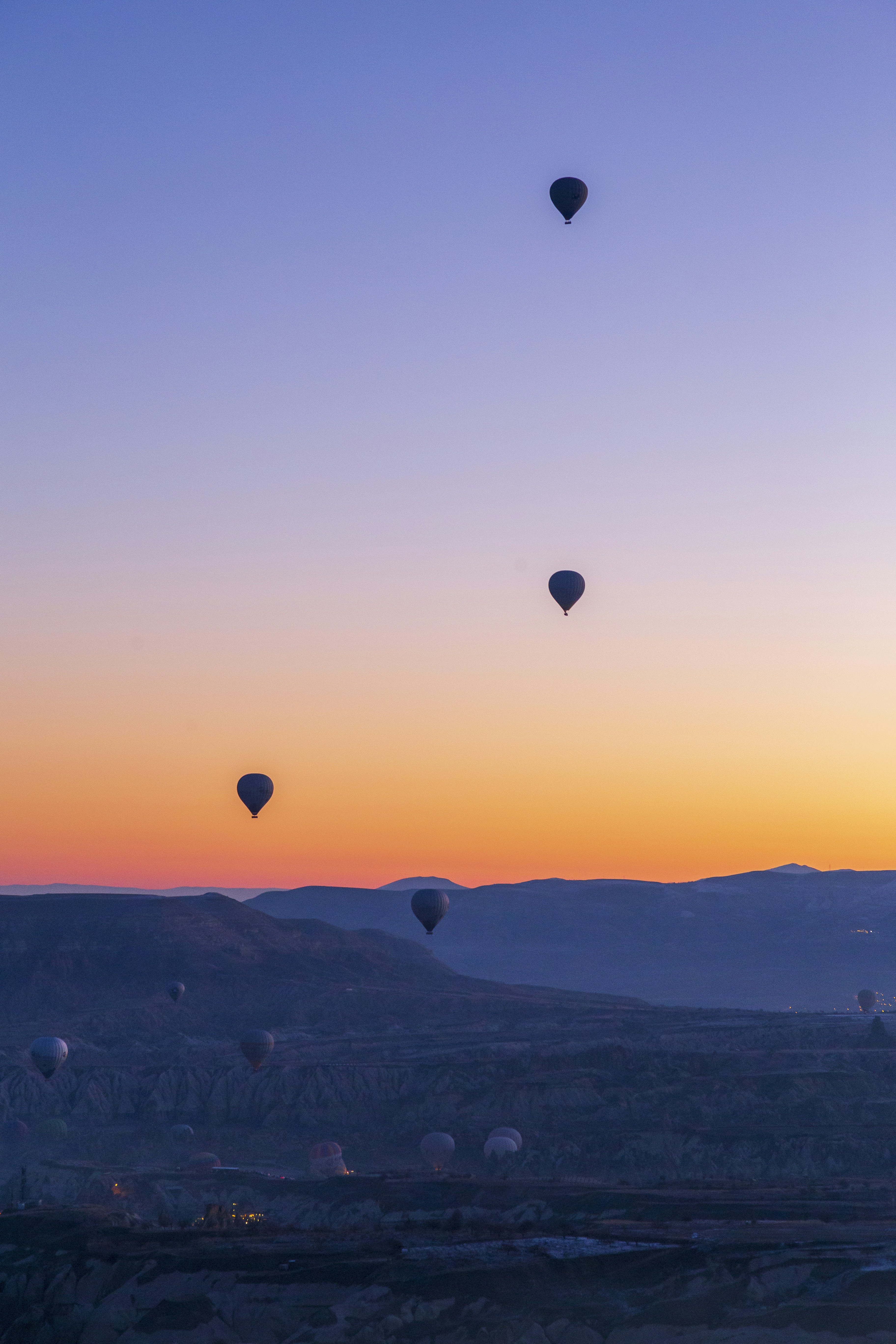 a group of hot air balloons flying in the sky