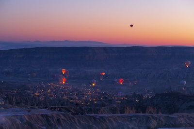 A stunning view of hot air balloons at sunrise.
