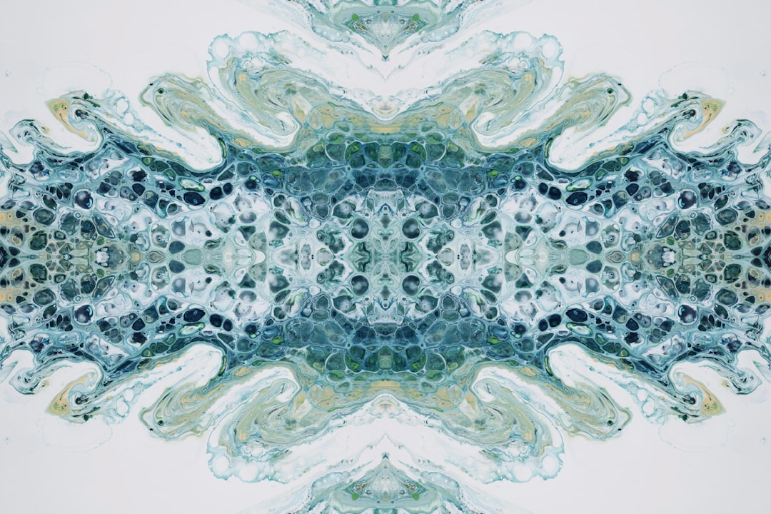 a blue and green abstract design on a white background,
