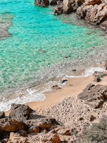 Turquoise waters caressing white sandy shores along Turkey’s stunning Mediterranean coast.