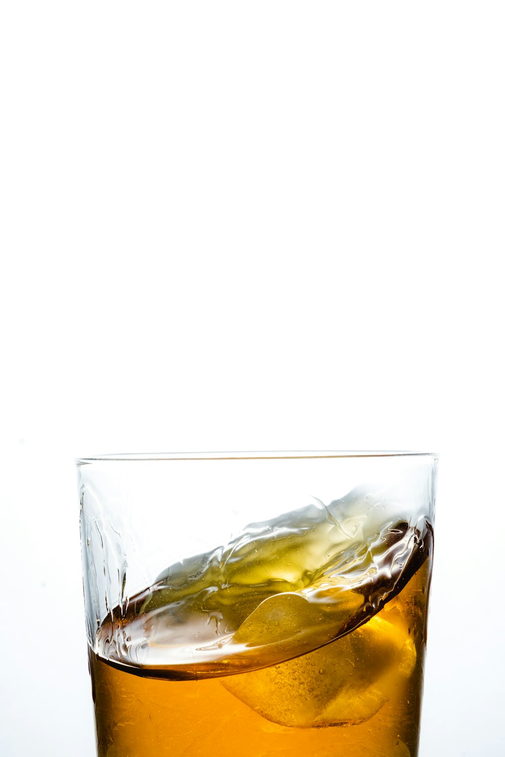 a close up of a drink in a glass on a table