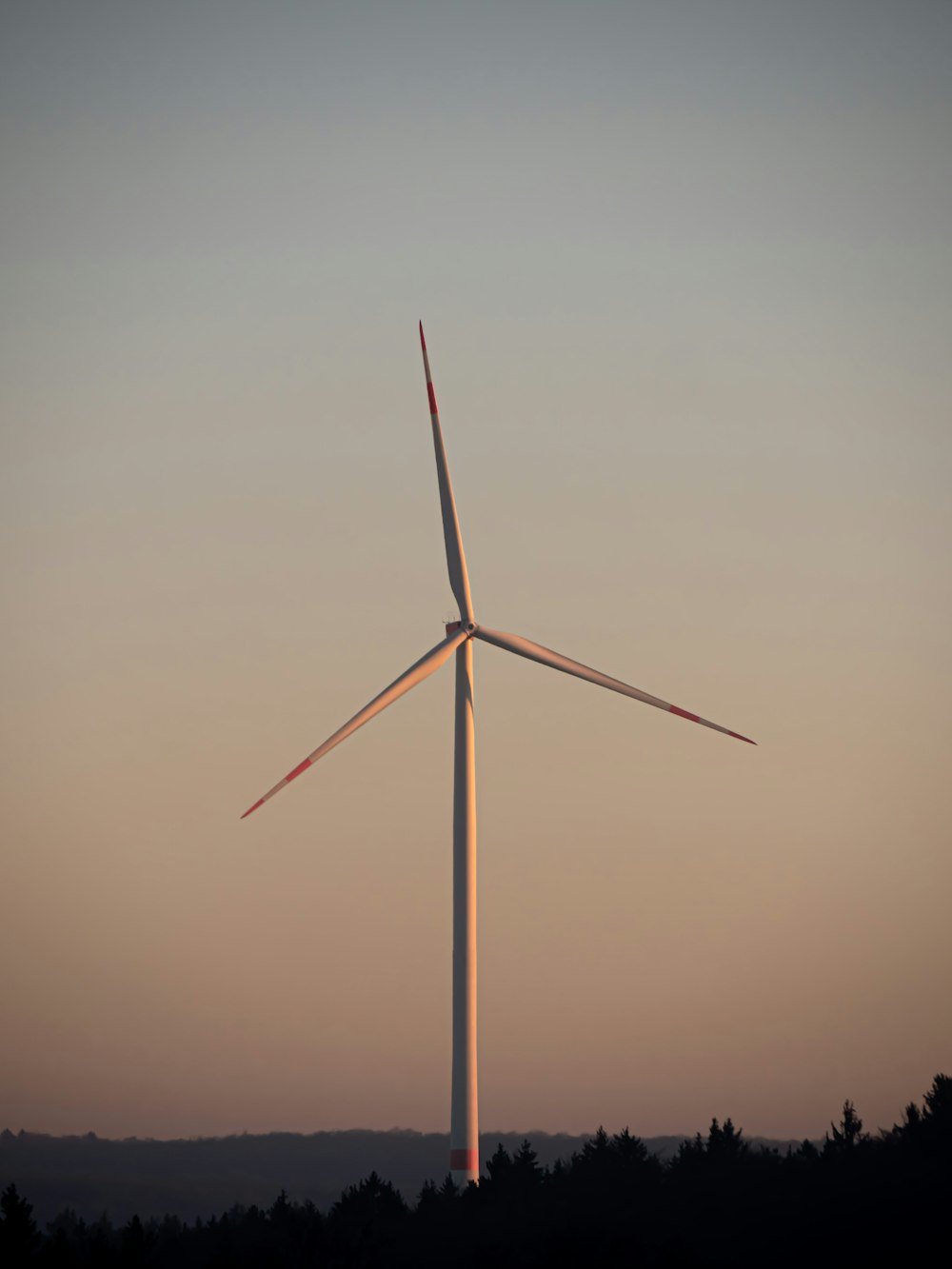 a wind turbine in the middle of a field