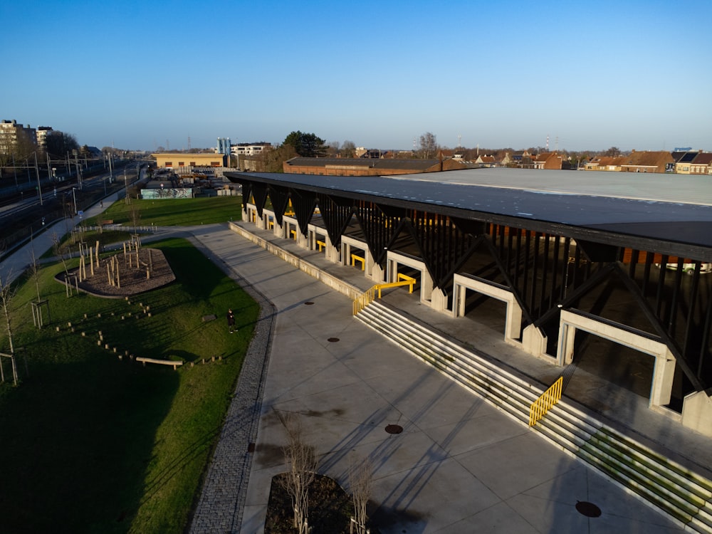 an aerial view of a train station in a city