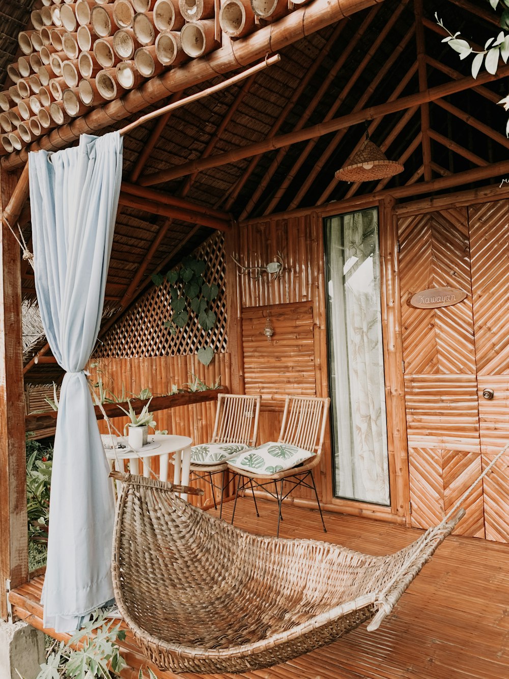 a hammock sitting on a wooden deck