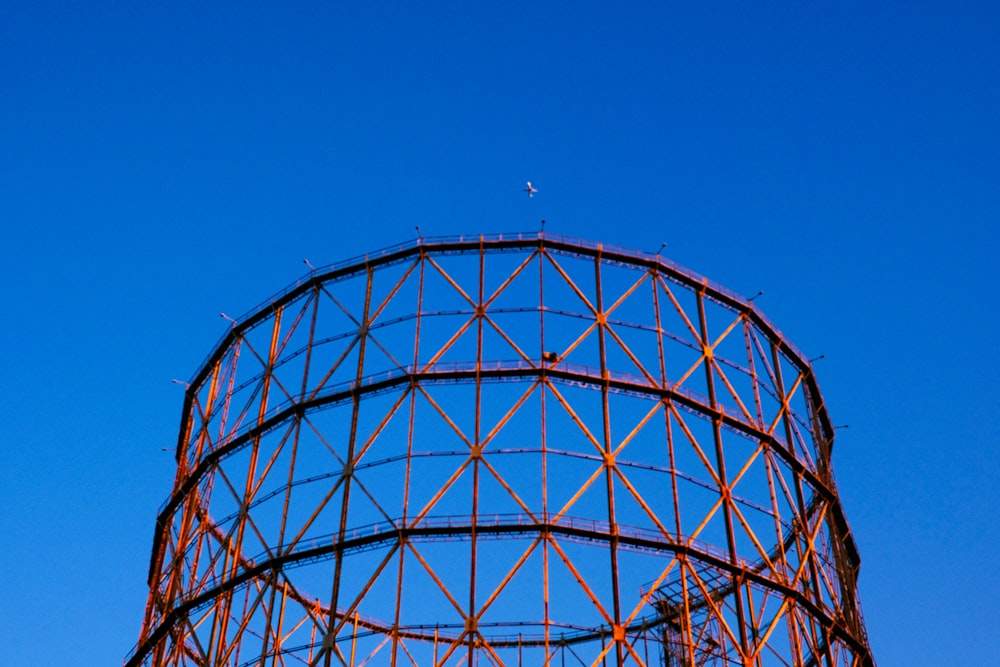 a large metal structure with a sky background