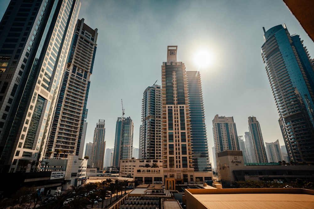 a view of a city with tall buildings in the foreground