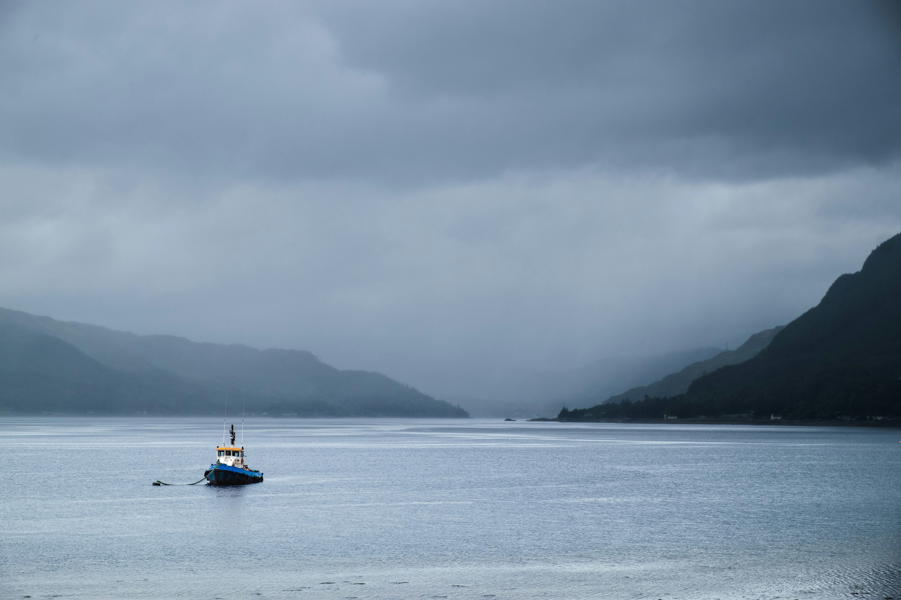 a boat floating on top of a large body of water