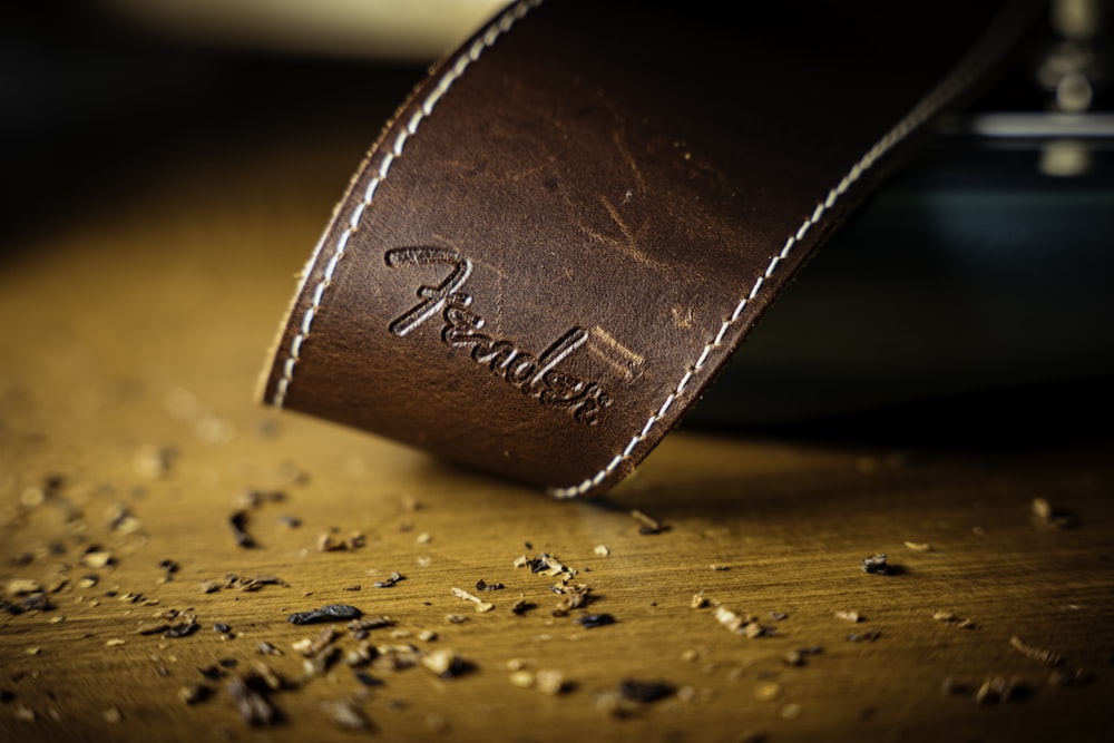 a close up of a leather band on a table