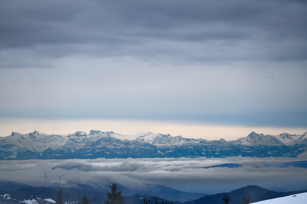 a view of a mountain range covered in snow