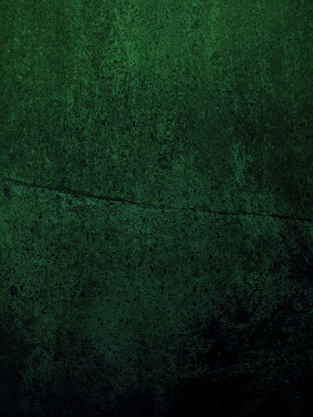 a dark green background with a grungy texture