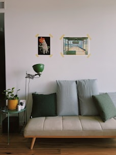 a couch sitting in a living room next to a table