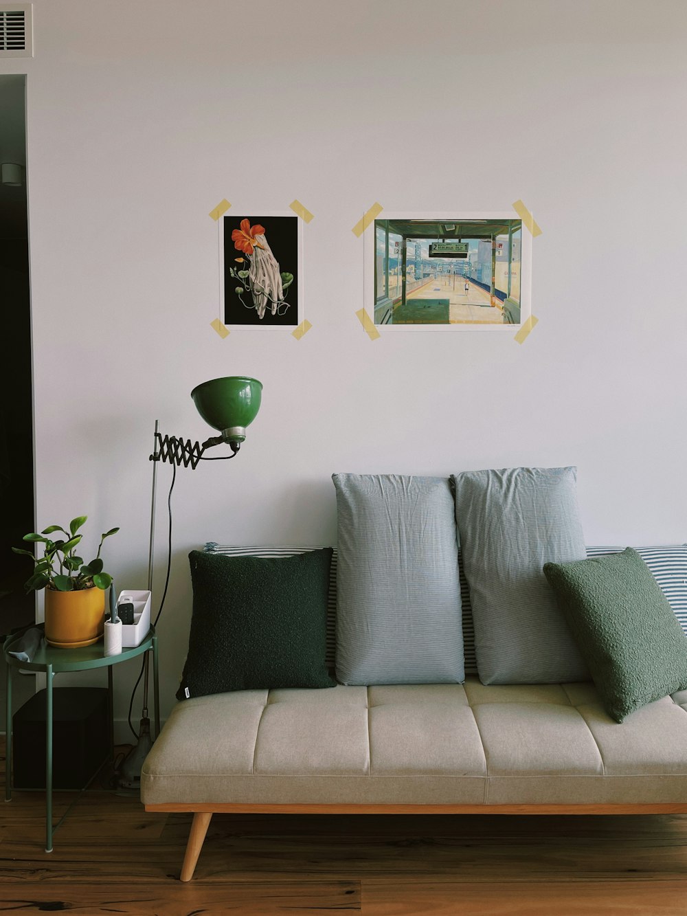 a couch sitting in a living room next to a table