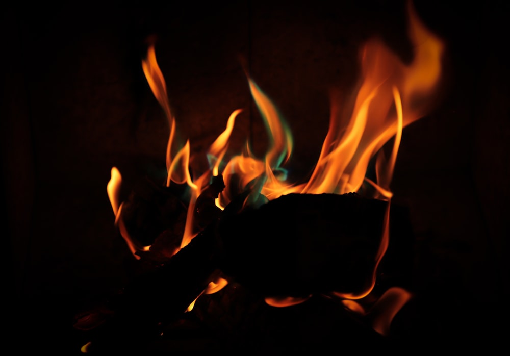 a close up of a fire in the dark