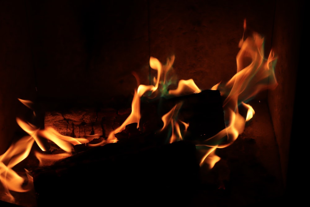 a fire burning in a fireplace with bright flames