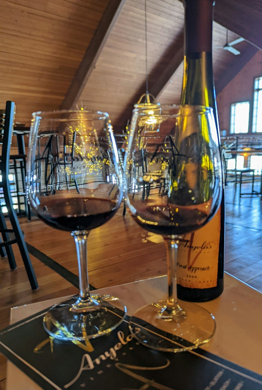 a couple of wine glasses sitting on top of a table