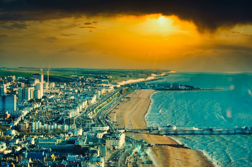 an aerial view of a city and the ocean