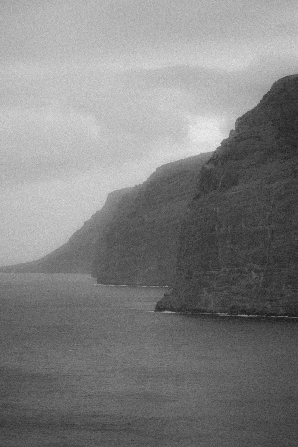 a black and white photo of a body of water