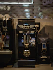 an espresso machine sitting next to a coffee maker