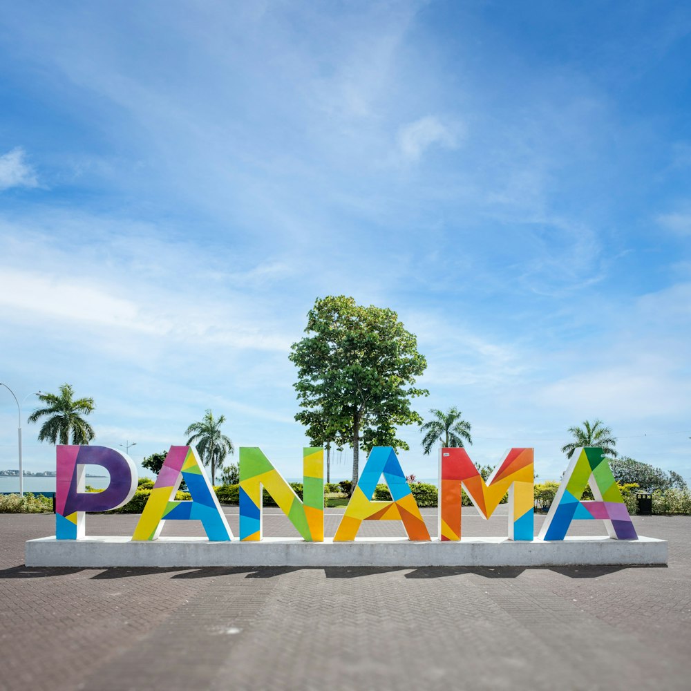 a large sign that says danama in multicolored letters