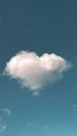 a cloud shaped like a heart in a blue sky