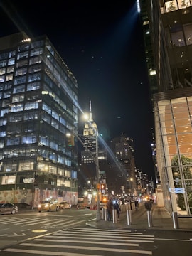 A city street illuminated by smart lighting at night.