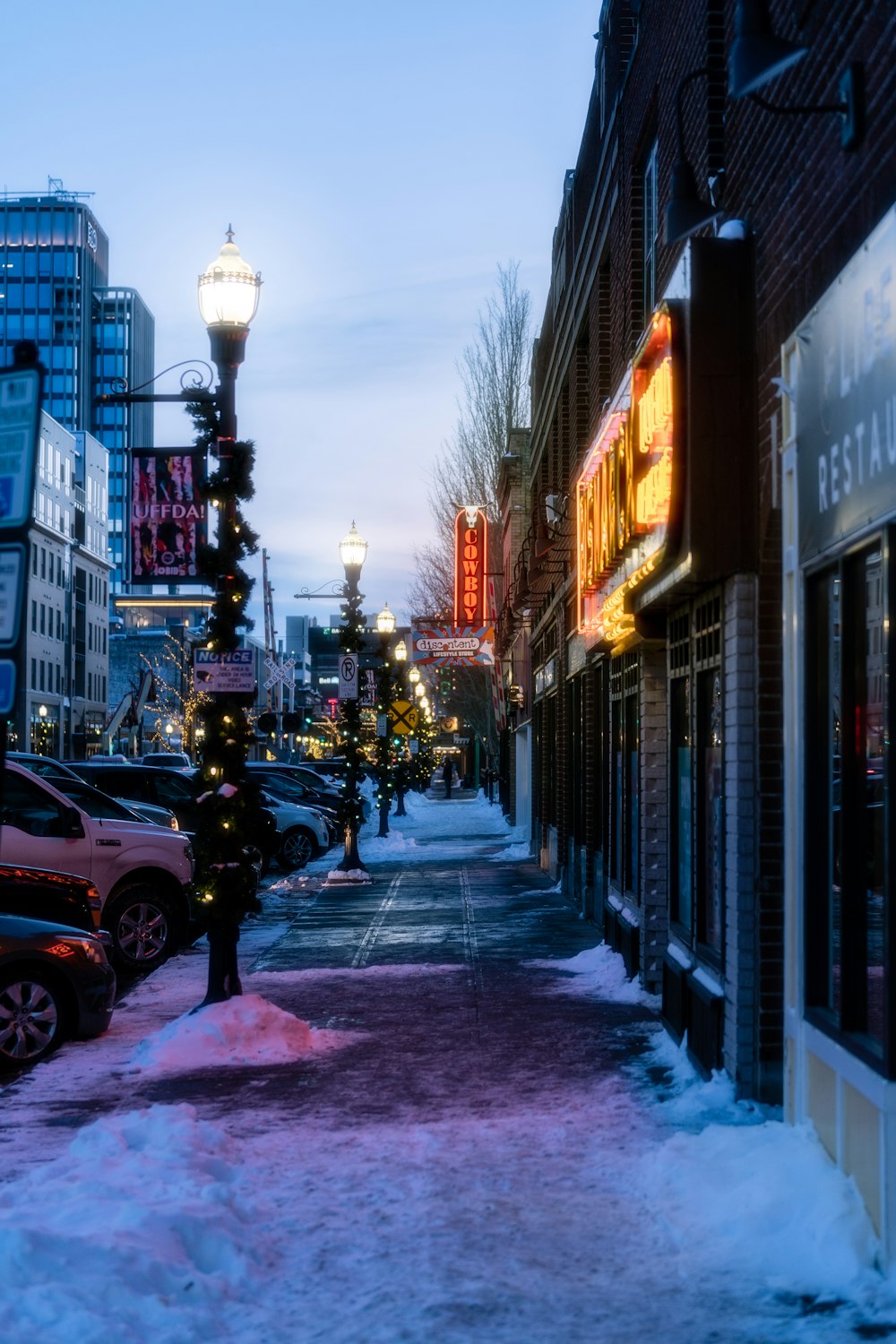 a city street with cars parked on the side of it