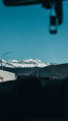 The majestic snow-capped peaks of the Andes near Cusco seen from a motorhome window