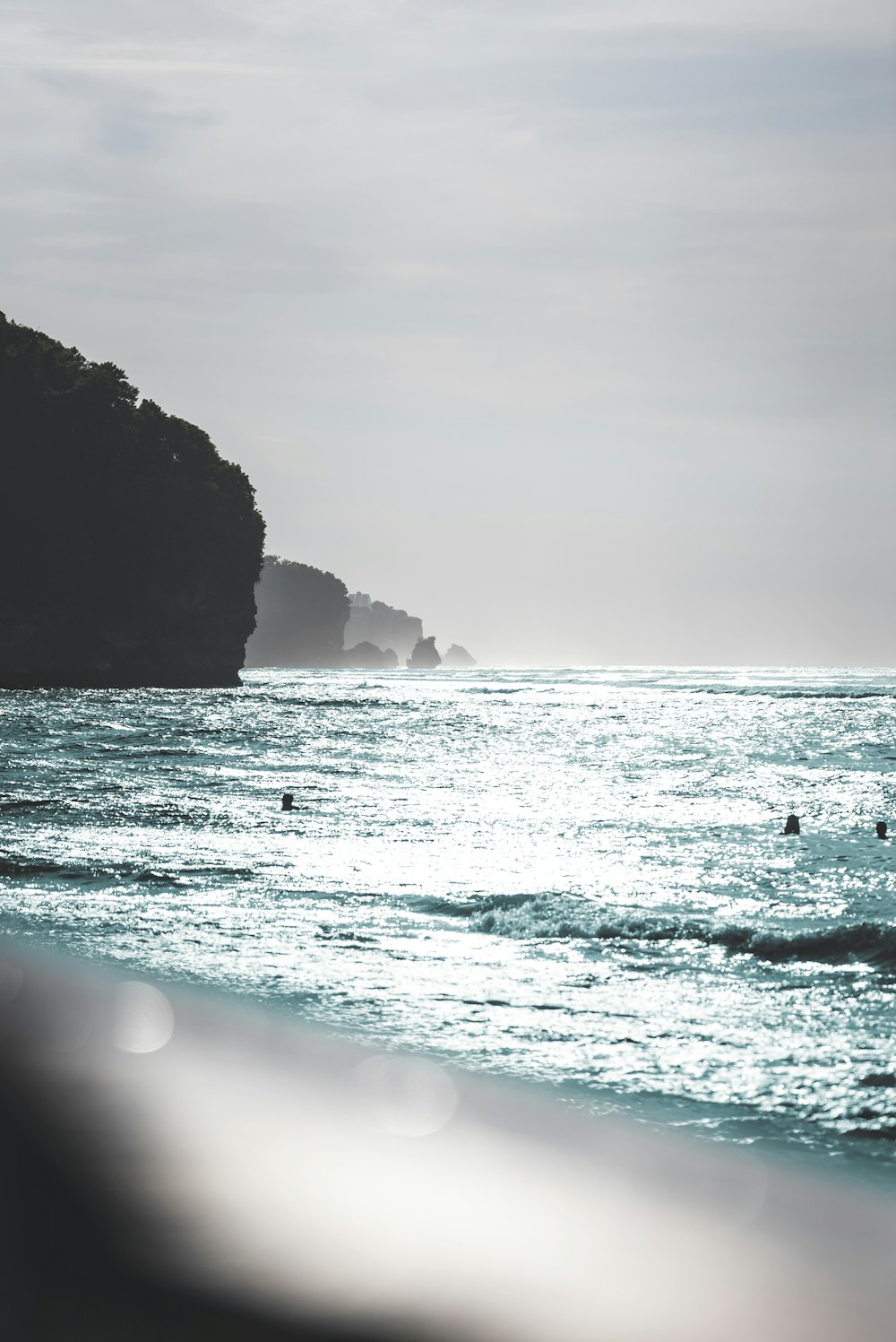 a body of water with people swimming in it