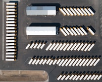 an aerial view of a parking lot with a lot of parked cars