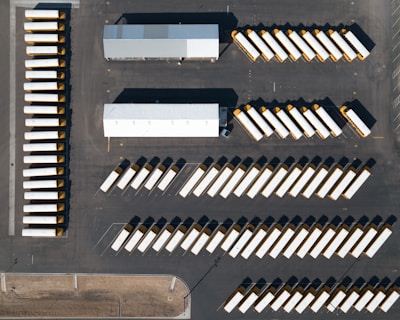 an aerial view of a parking lot with a lot of parked cars