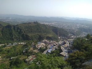 a view of a small village in the mountains