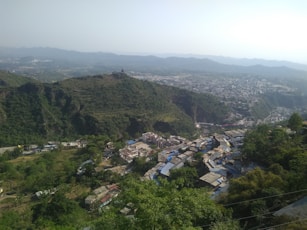 a view of a small village in the mountains