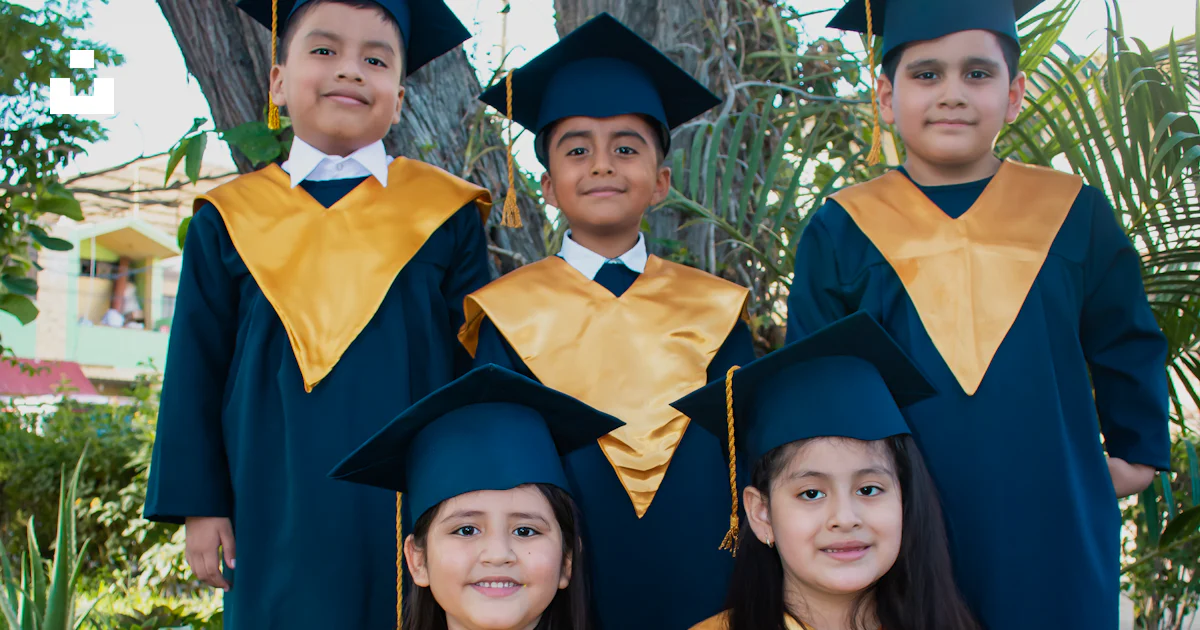Children Graduation Group A group of children in graduation gowns posing for a picture photo ...