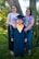A student receiving a scholarship award, surrounded by proud family members and teachers.