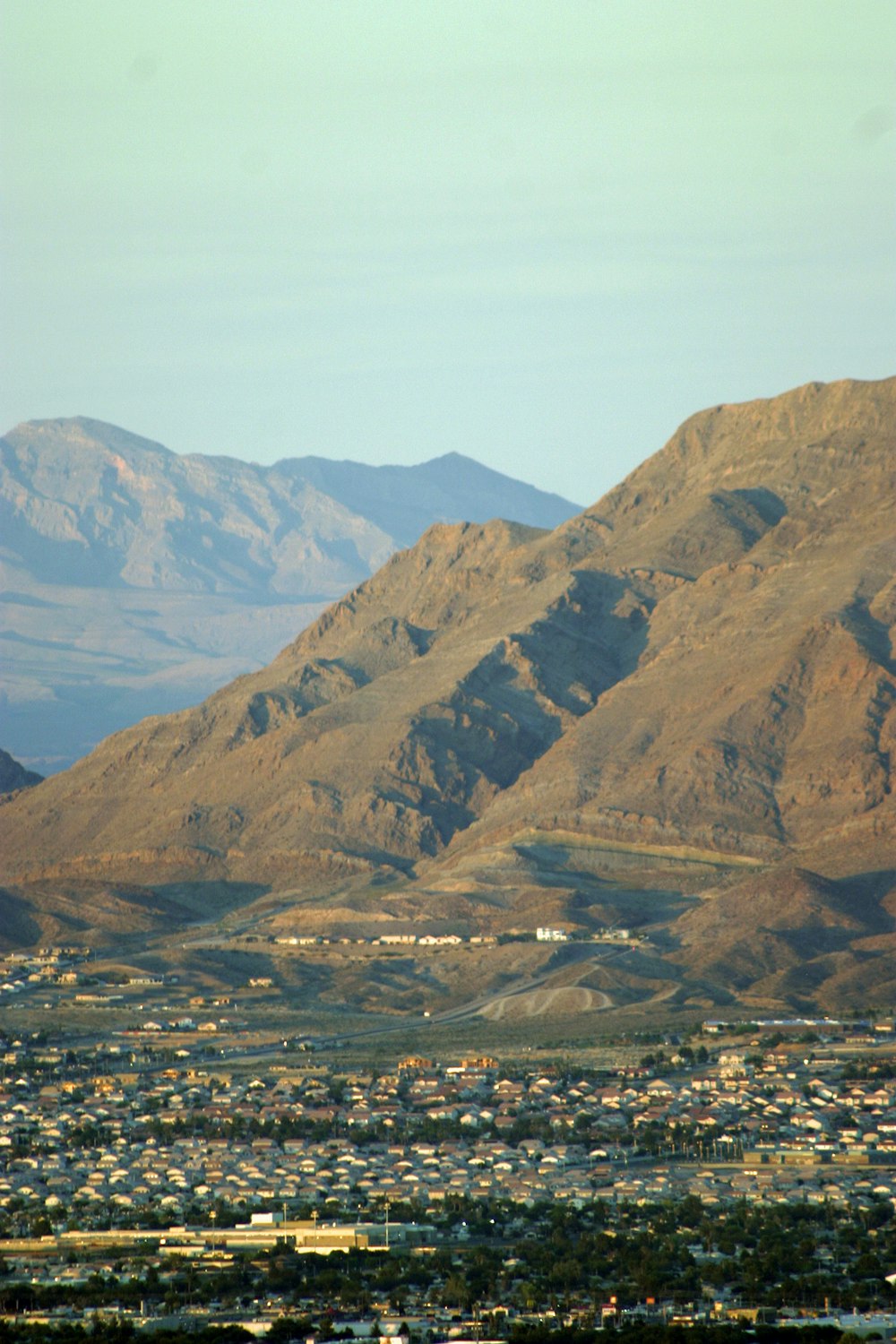 a view of a town in the middle of a mountain range