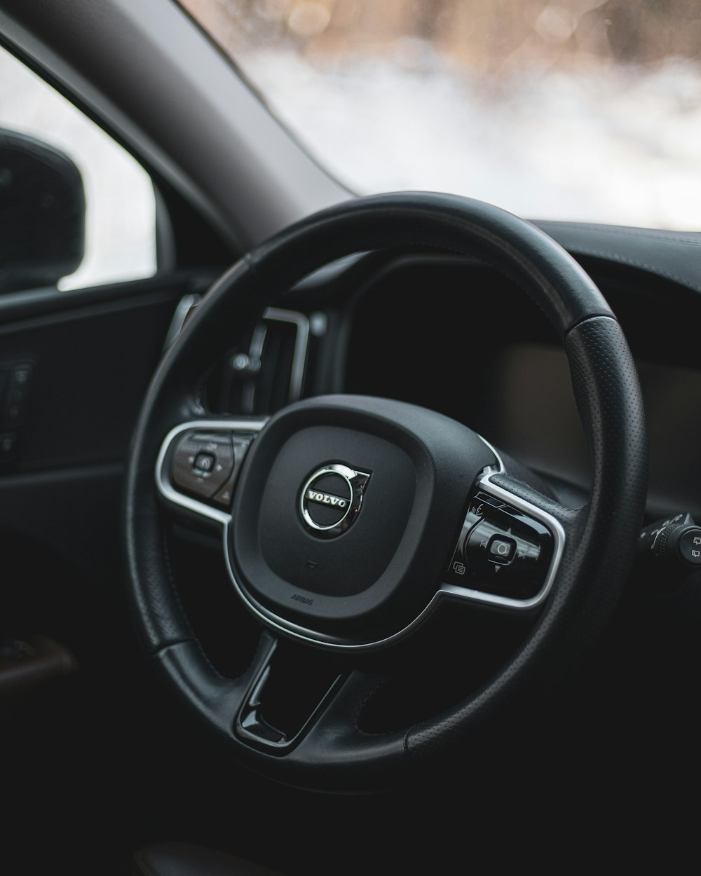 a steering wheel and dashboard of a car