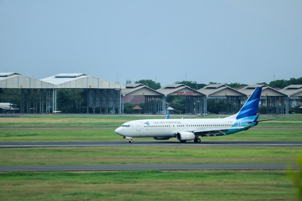 a large passenger jet sitting on top of an airport runway